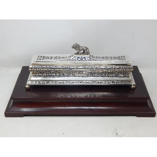 133 - 1930's Indian Silver Casket Surmounted with a Lion Sitting on Four Ball Feet on Hardwood Plinth Cont... 