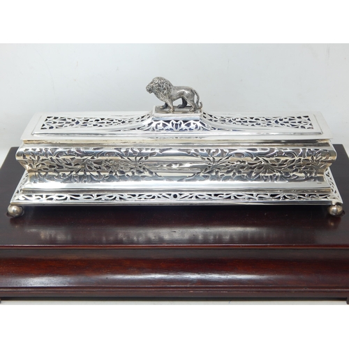 133 - 1930's Indian Silver Casket Surmounted with a Lion Sitting on Four Ball Feet on Hardwood Plinth Cont... 