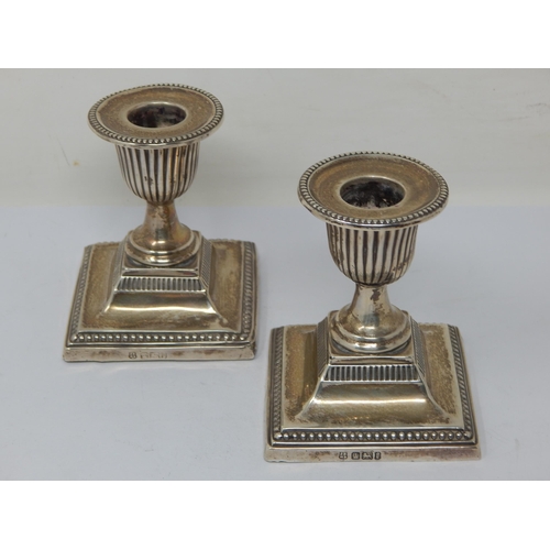 149 - A Pair of Edwardian Silver Weighted Candlesticks: Hallmarked Sheffield 1903 by John & William Deakin... 