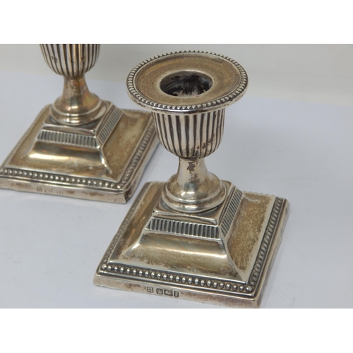 149 - A Pair of Edwardian Silver Weighted Candlesticks: Hallmarked Sheffield 1903 by John & William Deakin... 