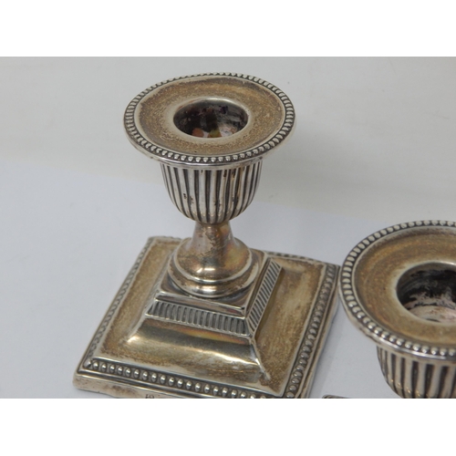 149 - A Pair of Edwardian Silver Weighted Candlesticks: Hallmarked Sheffield 1903 by John & William Deakin... 