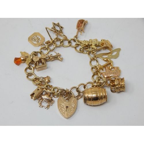 9ct Gold Charm Bracelet with Numerous Attached Charms: Weight 37.19g