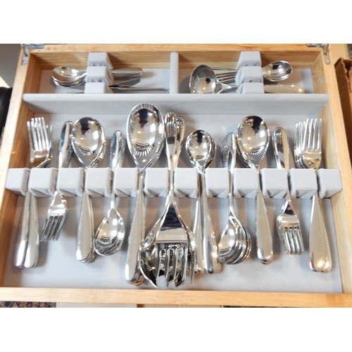 263 - Robert Welch (1929-2000): Full Canteen of Cutlery for 8 Place Settings with Servers (unused) in wood... 