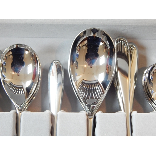 263 - Robert Welch (1929-2000): Full Canteen of Cutlery for 8 Place Settings with Servers (unused) in wood... 