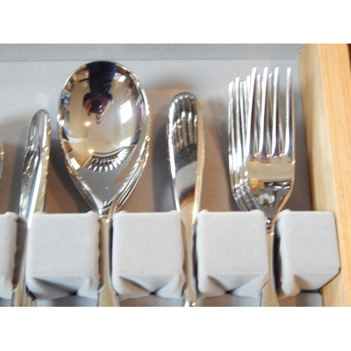 263 - Robert Welch (1929-2000): Full Canteen of Cutlery for 8 Place Settings with Servers (unused) in wood... 