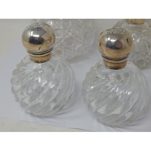 131N - A pair of Victorian Silver Mounted Perfume Bottles together with a Silver, Tortoiseshell & Pique Inl... 