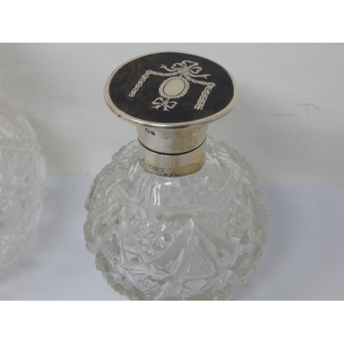 131N - A pair of Victorian Silver Mounted Perfume Bottles together with a Silver, Tortoiseshell & Pique Inl... 