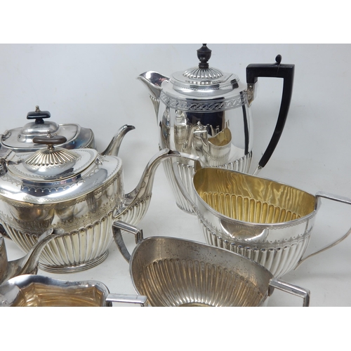 131V - A Quantity of Silver Plated Tea Wares Including Teapots, Sugar Bowls & Milk Jugs