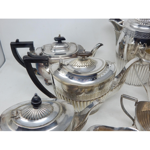 131V - A Quantity of Silver Plated Tea Wares Including Teapots, Sugar Bowls & Milk Jugs