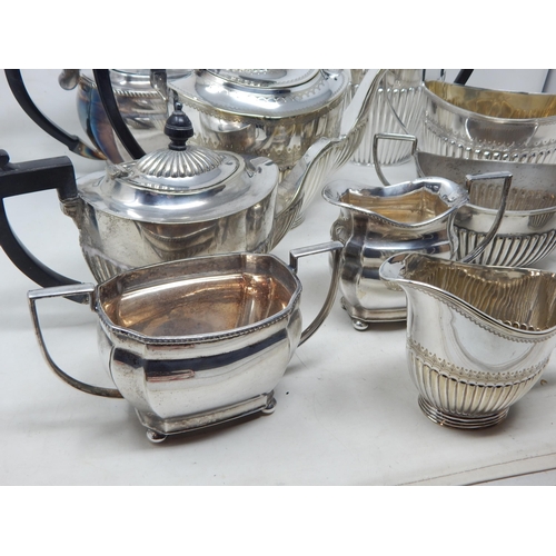 131V - A Quantity of Silver Plated Tea Wares Including Teapots, Sugar Bowls & Milk Jugs