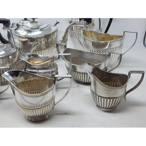 131V - A Quantity of Silver Plated Tea Wares Including Teapots, Sugar Bowls & Milk Jugs