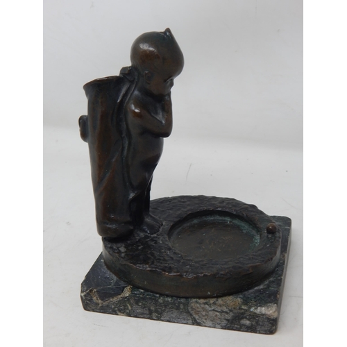 377 - 1930's Bronze Figure of a Small Boy Carrying a Golf bag & Clubs looking at the distant golf ball: Si... 