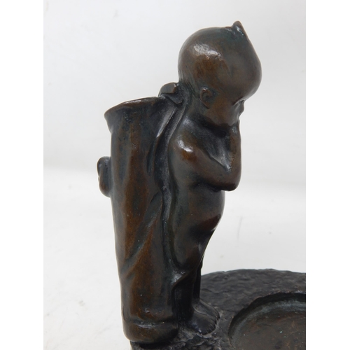 377 - 1930's Bronze Figure of a Small Boy Carrying a Golf bag & Clubs looking at the distant golf ball: Si... 