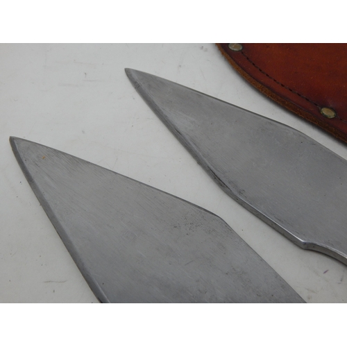 379 - A Pair of Professional Throwing Knives by Tru-Bal in Fitted Leather Sheath: Length 33.5cm