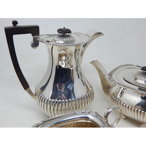 112A - George V Silver Four Piece Tea Service Comprising: Teapot, Hot Water Pot, Sugar Bowl & Milk Jug with... 