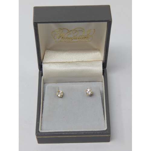 118 - A Pair of 18ct Gold Diamond Solitaire Earrings: The Diamonds of Good Colour & Clarity estimated @ 0.... 