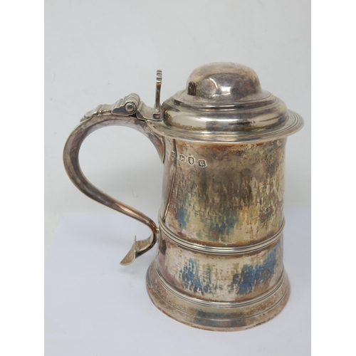 123 - An 18th Century George III Silver Lidded Tankard with domed lid and scroll handle: Hallmarked London...