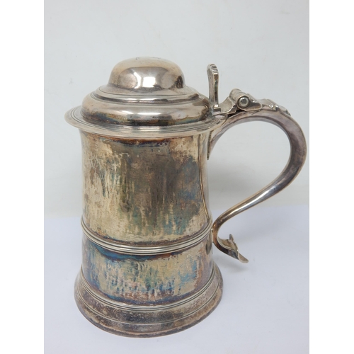 123 - An 18th Century George III Silver Lidded Tankard with domed lid and scroll handle: Hallmarked London... 