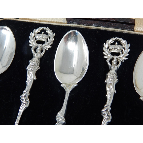 131 - A Set of 6 Victorian Silver Tea Spoons with Cast Silver Handles depicting Figures holding aloft a cr... 