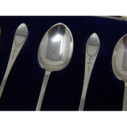 136 - A Set of 6 Silver Coffee Spoons: The terminals with blank cartouches: Hallmarked Sheffield 1926 by J... 