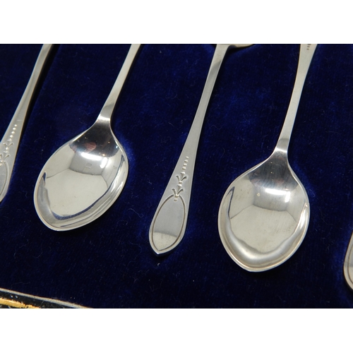 136 - A Set of 6 Silver Coffee Spoons: The terminals with blank cartouches: Hallmarked Sheffield 1926 by J... 