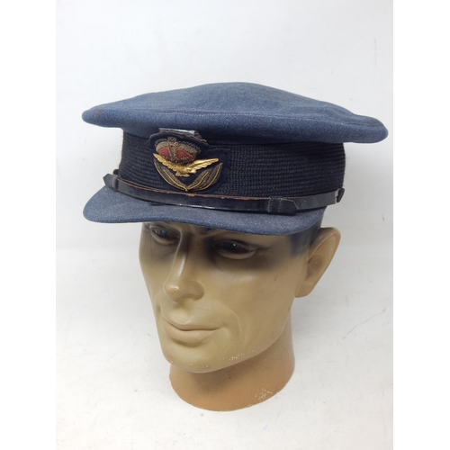 417 - A WWII RAF officers cap, blue cloth with G.A Dunn & Co tailor label, king's crown cloth insignia wit... 