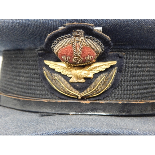 417 - A WWII RAF officers cap, blue cloth with G.A Dunn & Co tailor label, king's crown cloth insignia wit... 