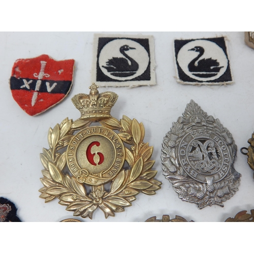 441 - A Quantity of Military Brass & White Metal Badges together with cloth badges & insignia.