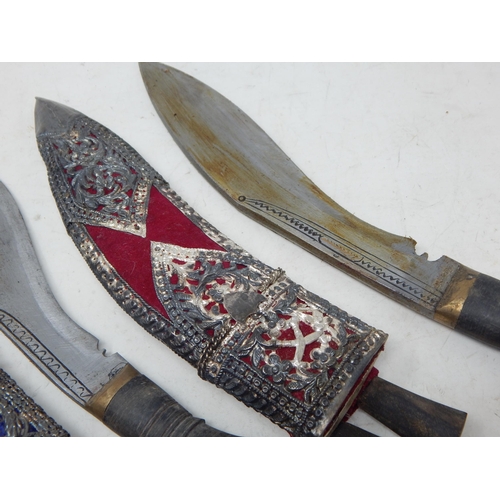 447 - Three Nepalese Kothamora Kukris in Indian Silver Decorated Sheaths: Largest 31cm overall