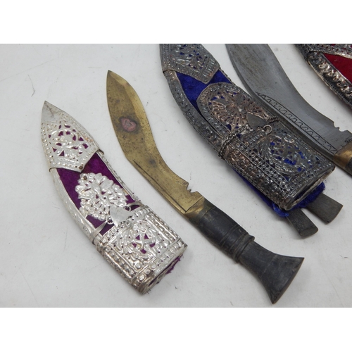 447 - Three Nepalese Kothamora Kukris in Indian Silver Decorated Sheaths: Largest 31cm overall