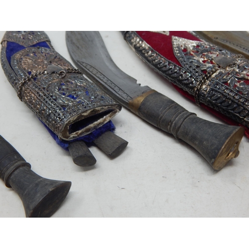 447 - Three Nepalese Kothamora Kukris in Indian Silver Decorated Sheaths: Largest 31cm overall