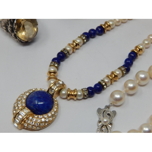 239 - Christian Dior Signed Necklace together with a string of pearls with white metal clasp marked K14, a... 