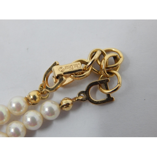 239 - Christian Dior Signed Necklace together with a string of pearls with white metal clasp marked K14, a... 