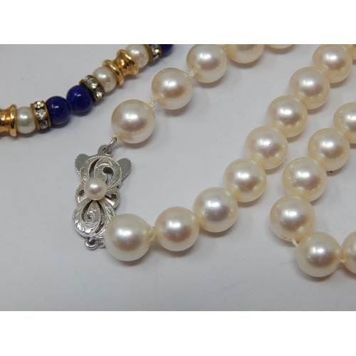 239 - Christian Dior Signed Necklace together with a string of pearls with white metal clasp marked K14, a... 