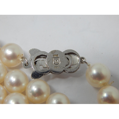 239 - Christian Dior Signed Necklace together with a string of pearls with white metal clasp marked K14, a... 