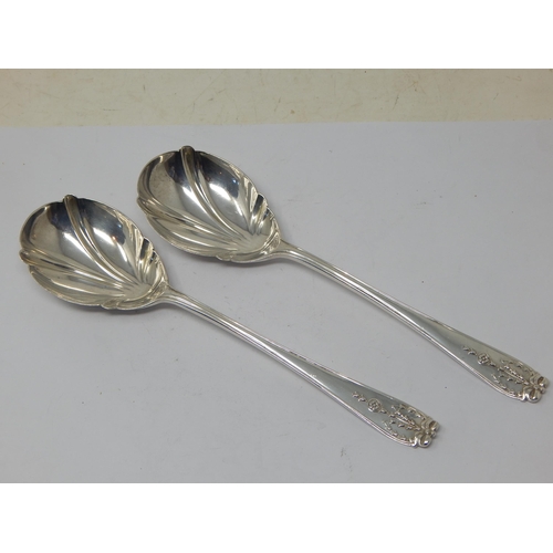 272 - A Pair of Silver Fruit Serving Spoons: Hallmarked London 1913 by Josiah William & Co: Length 21.5cm:... 