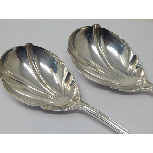 272 - A Pair of Silver Fruit Serving Spoons: Hallmarked London 1913 by Josiah William & Co: Length 21.5cm:... 