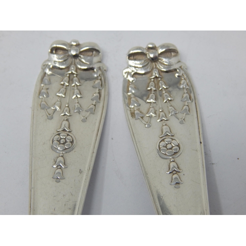 272 - A Pair of Silver Fruit Serving Spoons: Hallmarked London 1913 by Josiah William & Co: Length 21.5cm:... 