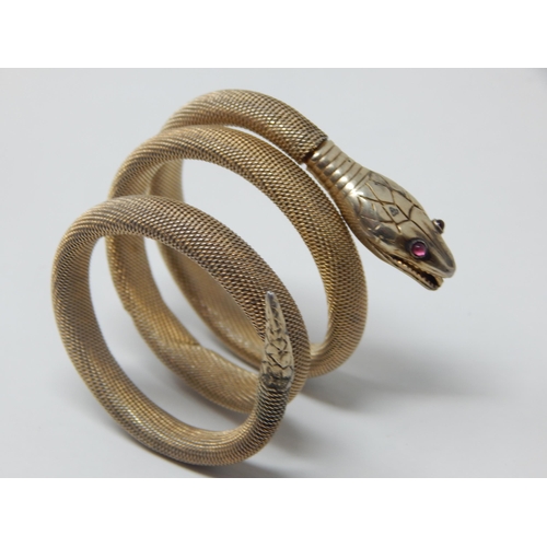 275C - Continental 800 Standard Silver Gilt Expandable Coiled Snake Bracelet Set with Red Cabochon Eyes.