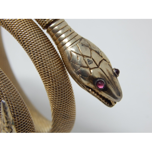 275C - Continental 800 Standard Silver Gilt Expandable Coiled Snake Bracelet Set with Red Cabochon Eyes.