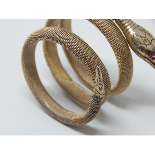 275C - Continental 800 Standard Silver Gilt Expandable Coiled Snake Bracelet Set with Red Cabochon Eyes.