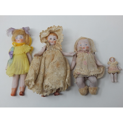 400I - Antique Miniature Bisque Dolls in Original Costumes: Smallest 3cm - Largest 7.5cm