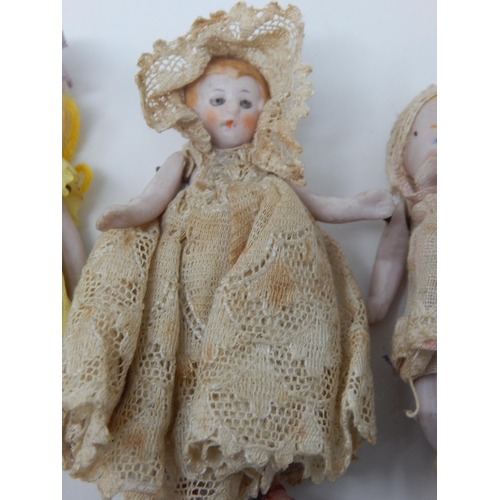 400I - Antique Miniature Bisque Dolls in Original Costumes: Smallest 3cm - Largest 7.5cm