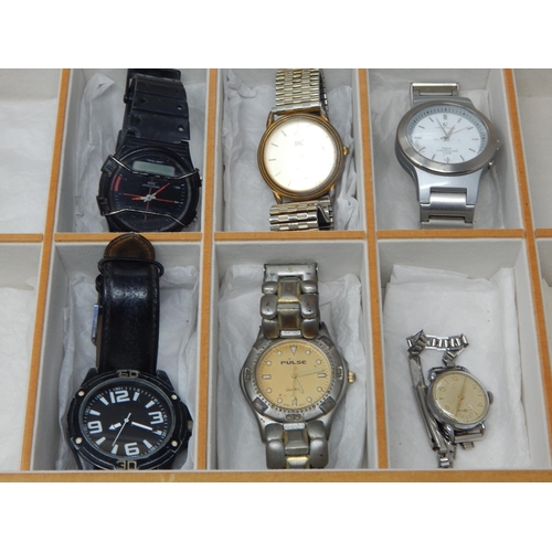 404 - A Group of Wristwatches contained in a Glass Top Wooden Watch Display Case with Lower Drawer