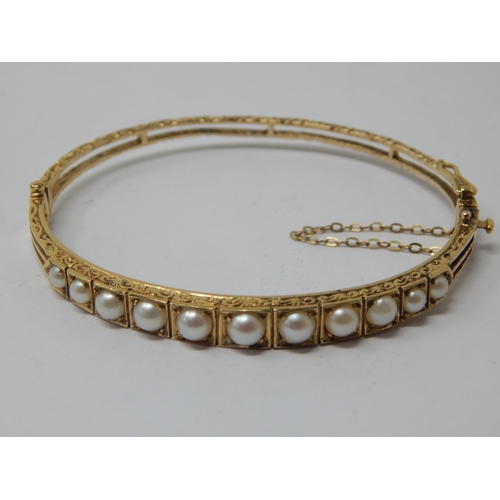 9ct Gold & Pearl Set bangle with safety chain: weight 11.55g