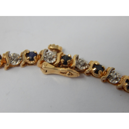 215 - 9ct Gold Gem Set Tennis Bracelet: Length 18cm: Weight 6.72g