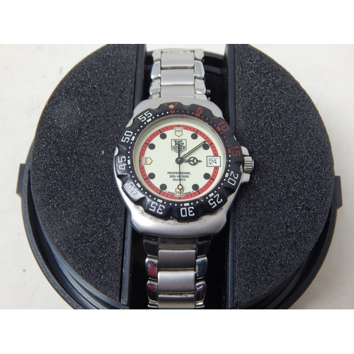 298 - TAG HEUER - a mid-size stainless steel Formula 1 quartz bracelet watch, Serial no: 371513, luminous ... 