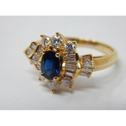 229 - 18ct Gold Diamond & Sapphire Set Ring: The Central Oval Cut Sapphire estimated @ 0.50cts within a bo... 