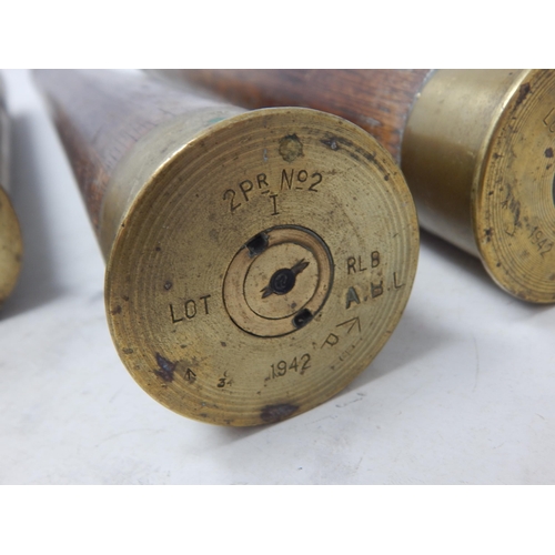 478 - WWII: A Pair of Brass Shell Cases 1939 measuring 30cm together with a Pair of Brass & Wooden Trainin... 