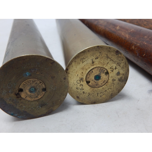 478 - WWII: A Pair of Brass Shell Cases 1939 measuring 30cm together with a Pair of Brass & Wooden Trainin... 